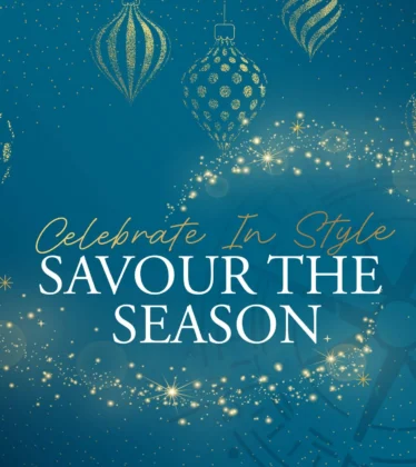 Festive hotel dining promotion banner with gold baubles, twinkling lights and "Savour the Season" message, welcoming seasonal offers